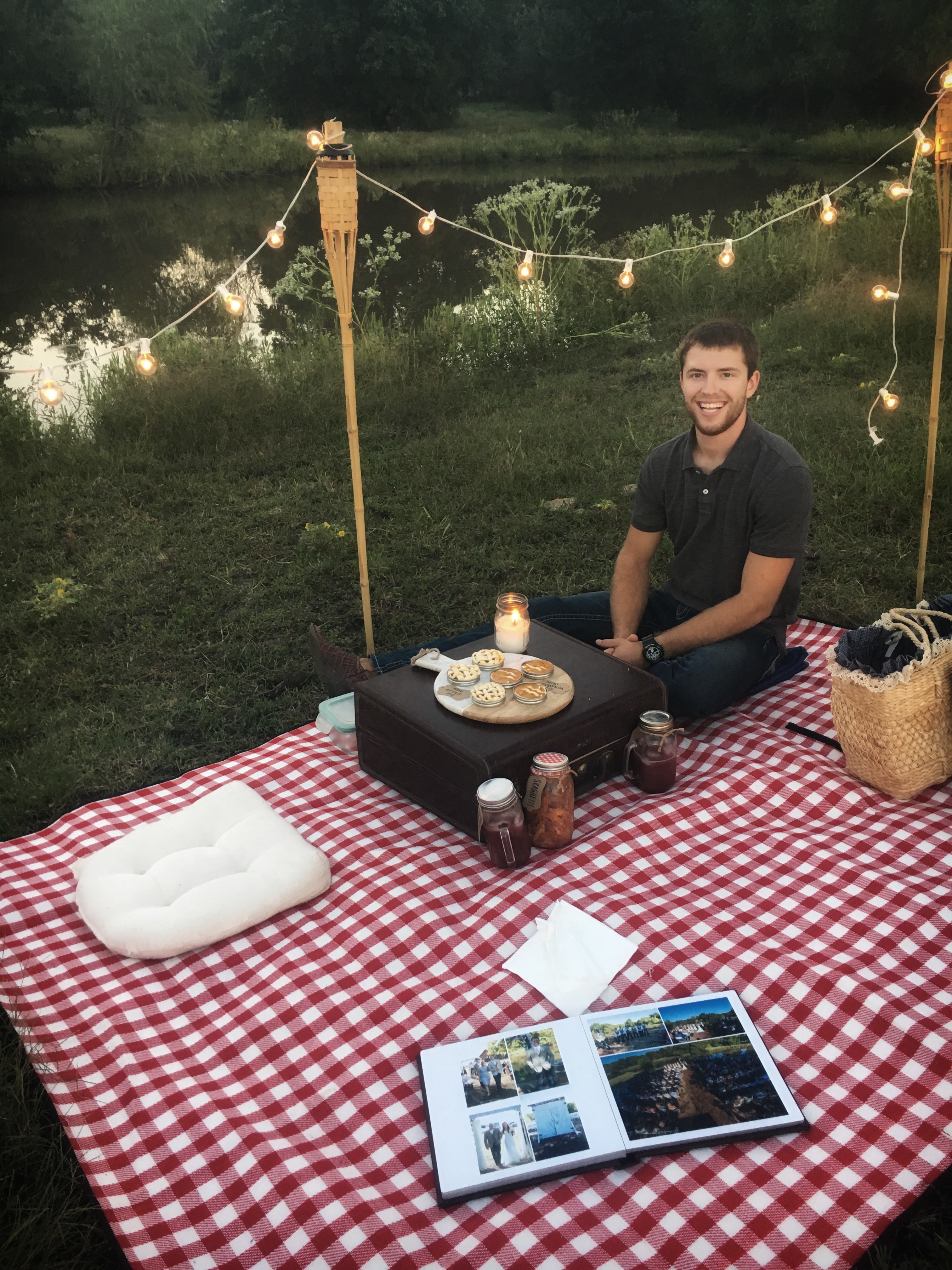 cute dessert, romantic picnic setting, pond, lights, photo book